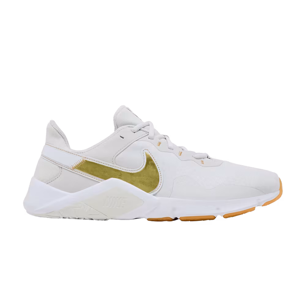 Nike Women's Legend Essential 2 Platinum Tint Metallic Gold Star